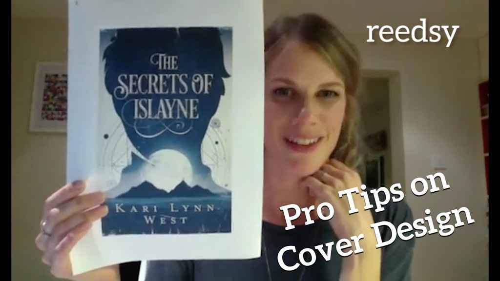 Book Design | Designer Anna Woodbine holds up a cover design