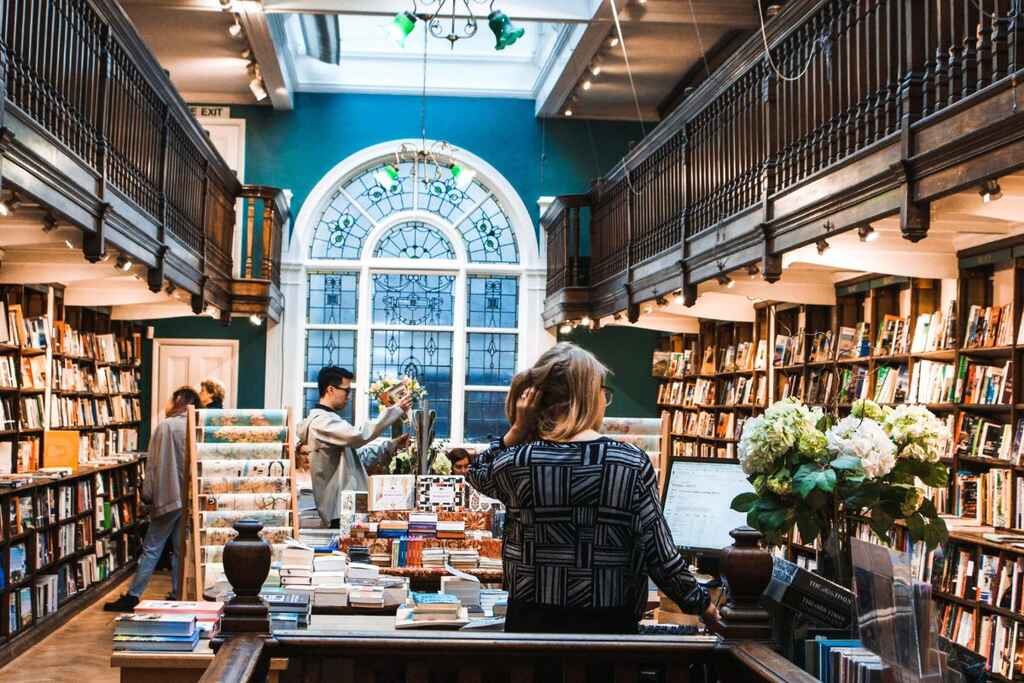 A bookstore with a bookseller in the foreground