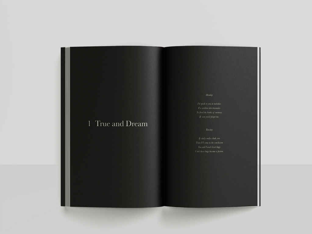 A sleek, black double page spread with minimal white typeface, allowing the poem to stand out among all the empty black space.