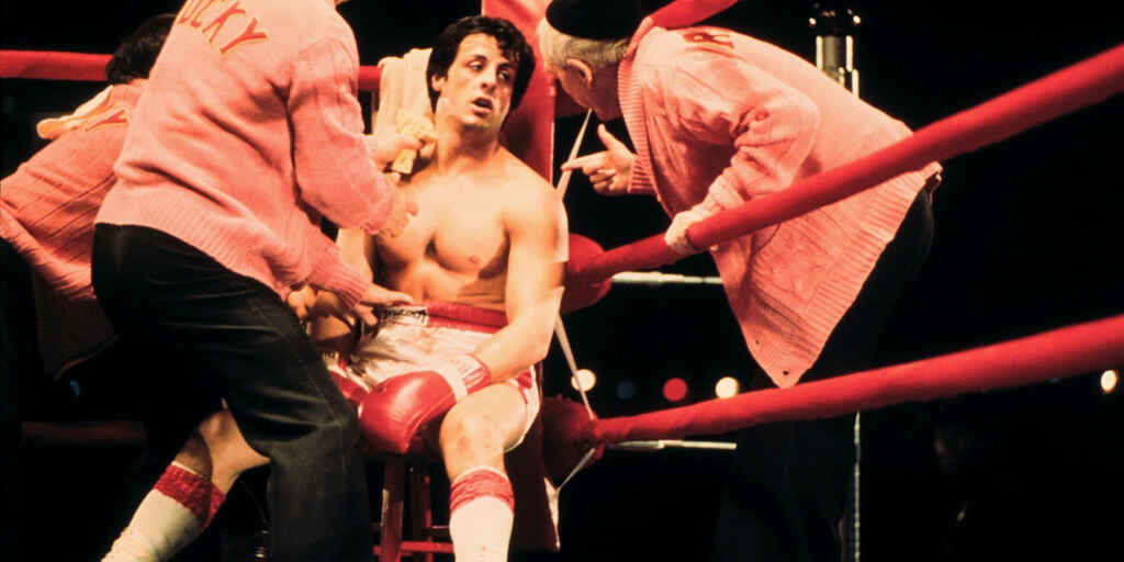 Image of Rocky Balboa on the ropes during a fight
