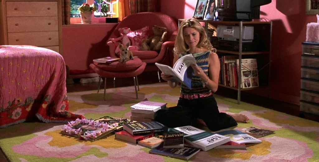 conflict | Elle from Legally Blonde, sat on the floor surrounded by law books