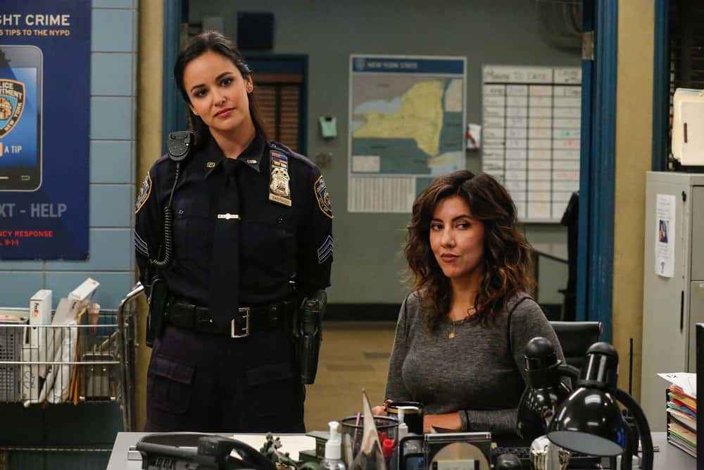 How to find an editor | Photo of Rosa and Amy from the TV series Brooklyn 99. The two are in uniform, looking at the camera while in their police uniform.