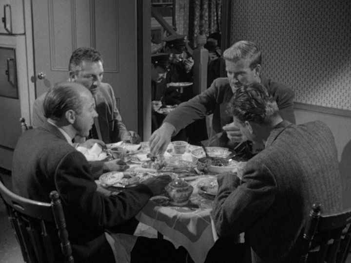 types of irony | Detectives sitting around a table, eating a freshly cooked roast.