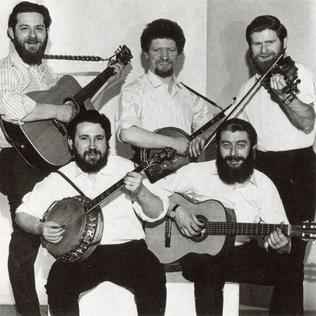 Theme of a story | Photograph of Irish band the Dubliners, holding their instruments.
